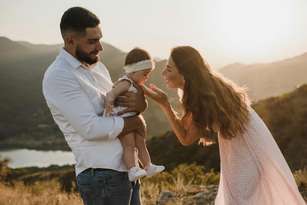 A man and woman with their kid