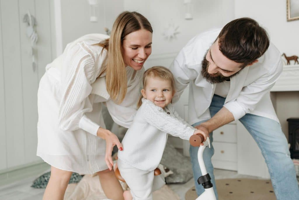 A man and woman with their child