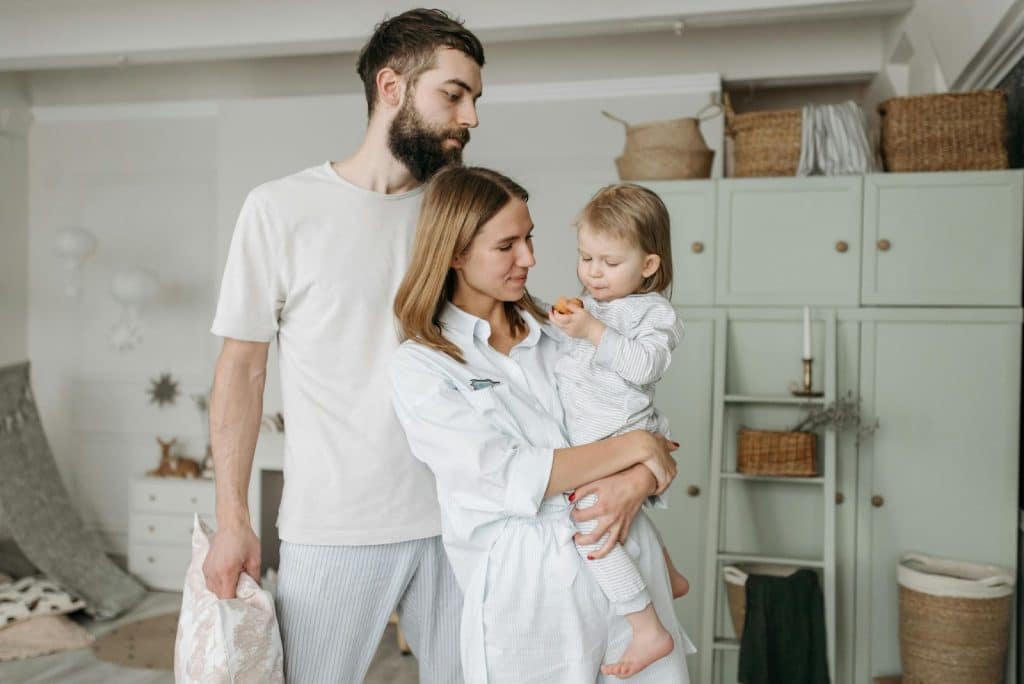 A man and woman with their child