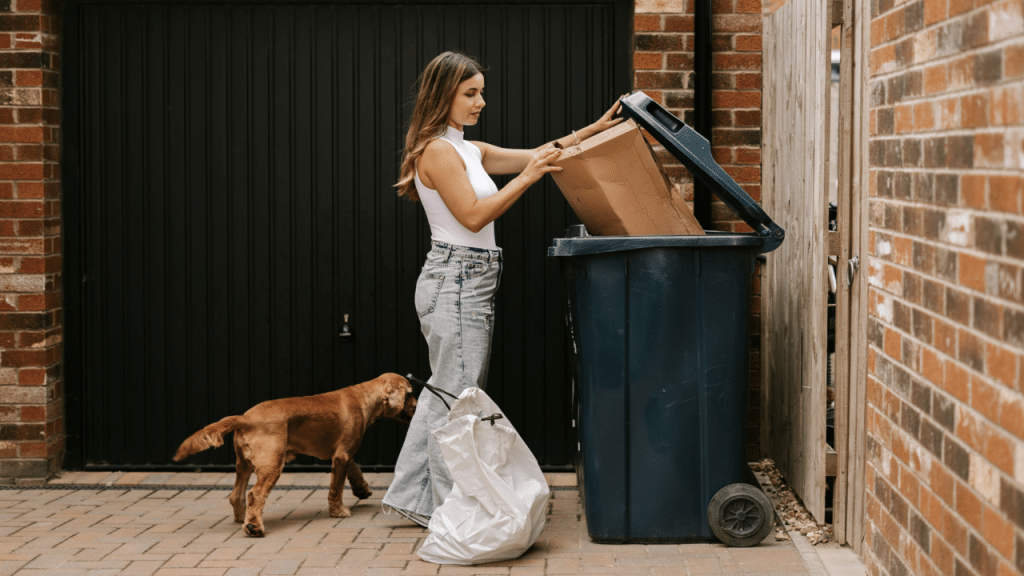 A woman taking out the trash
