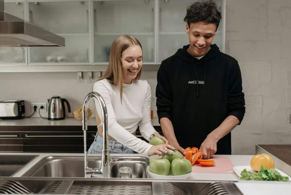 A man and woman cooking together