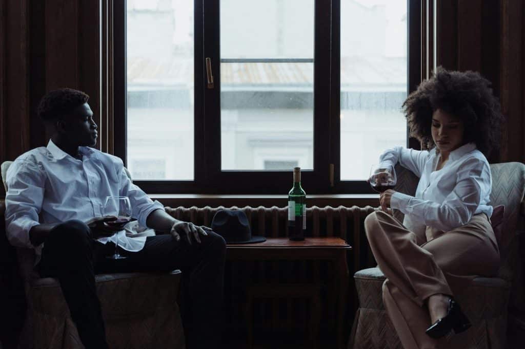 A man waiting for a woman to answer