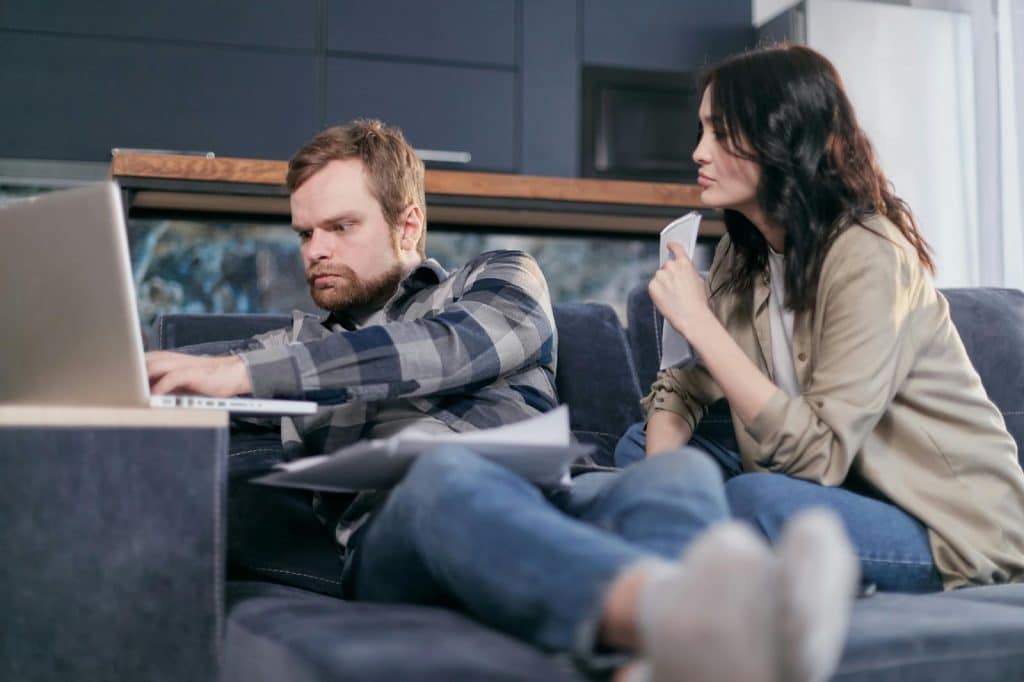 A man and woman at the couch