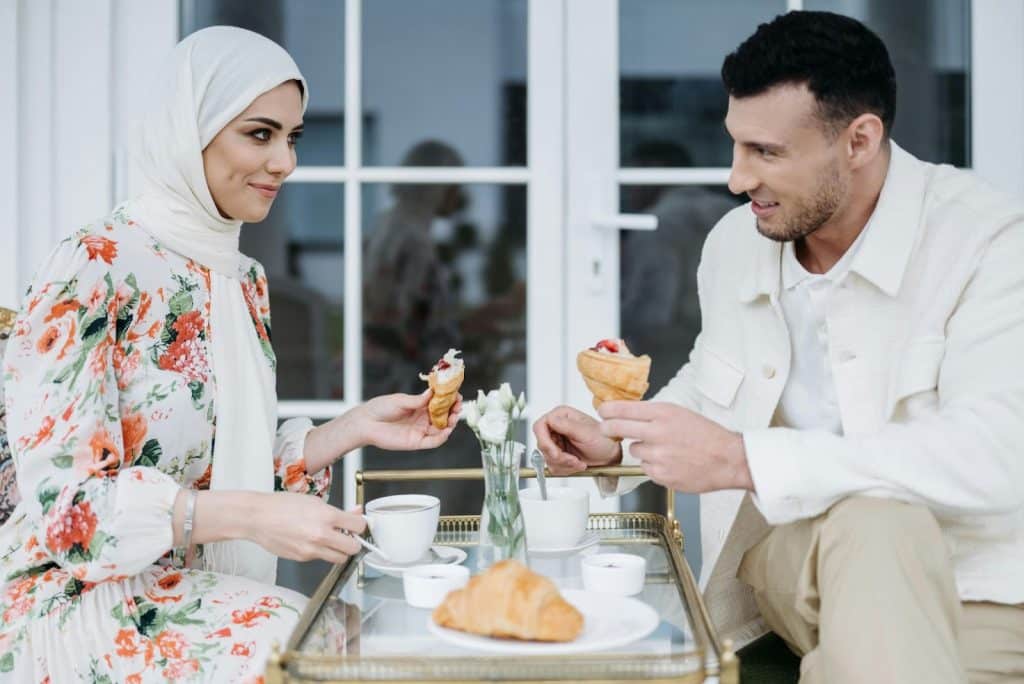 A man and woman eating together