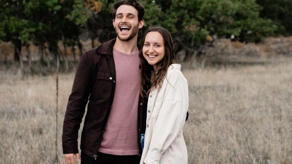 Couple standing together, height difference visible, smiling
