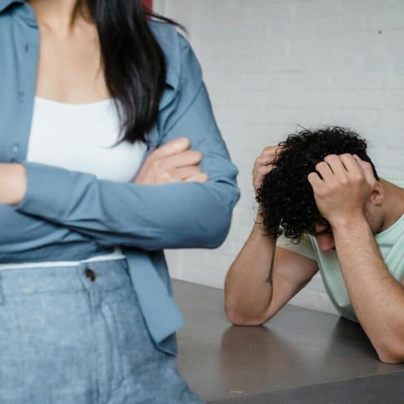 A couple having a fight in the dining room
