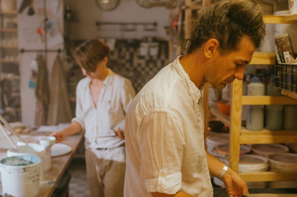 A man and woman doing their own thing