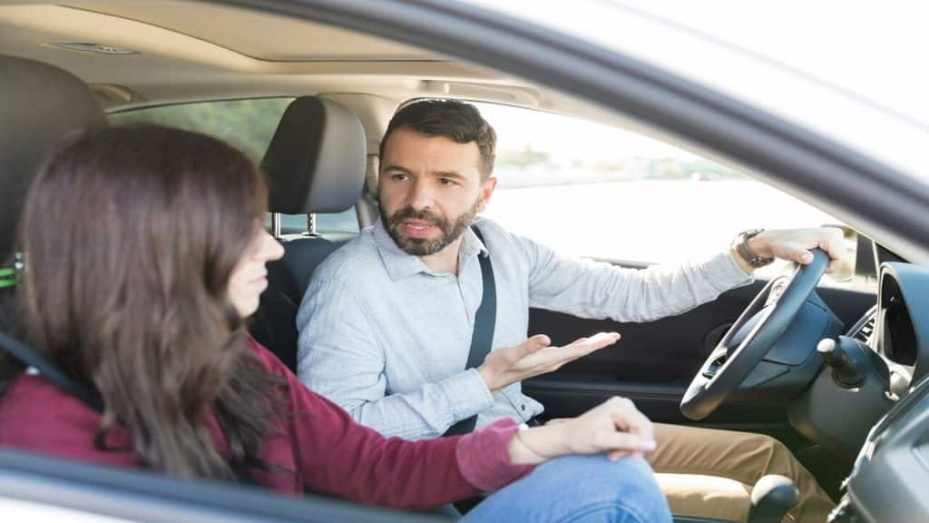 A couple having a discussion in the car