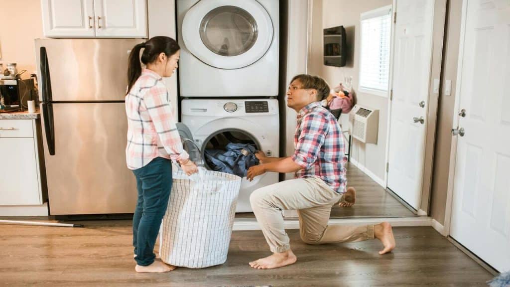 A couple doing laundry together