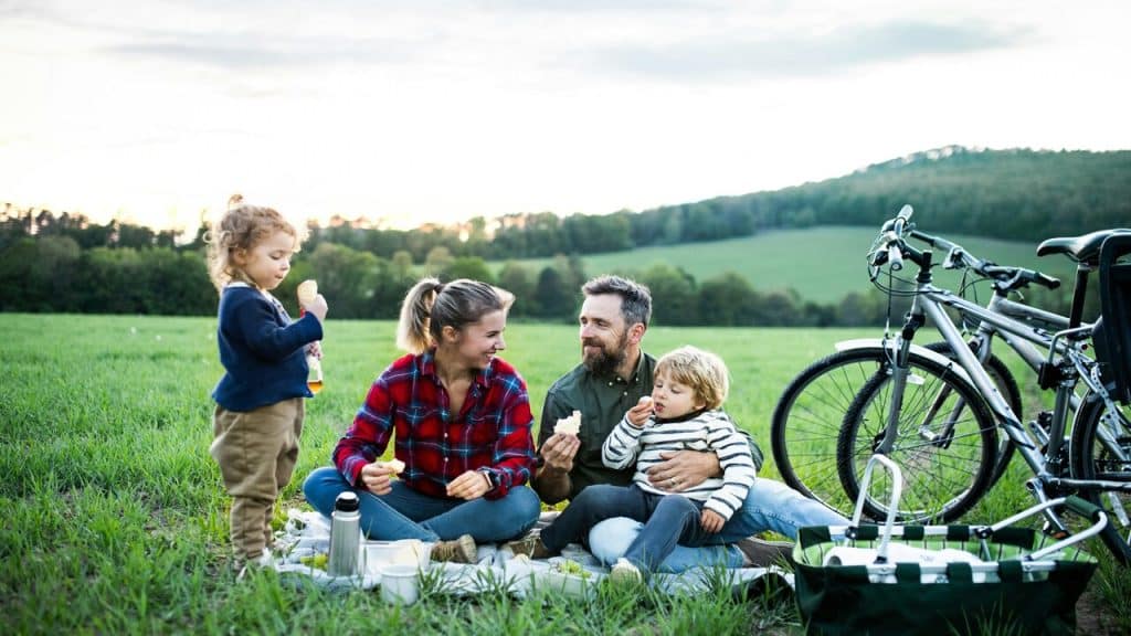 A couple with the kids at the park