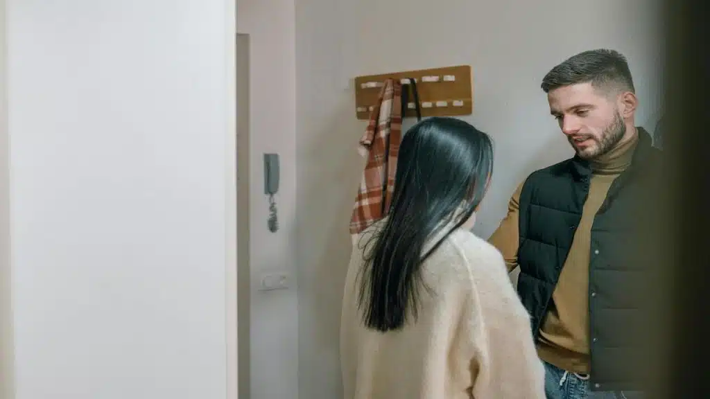 A couple having a serious talk in the apartment