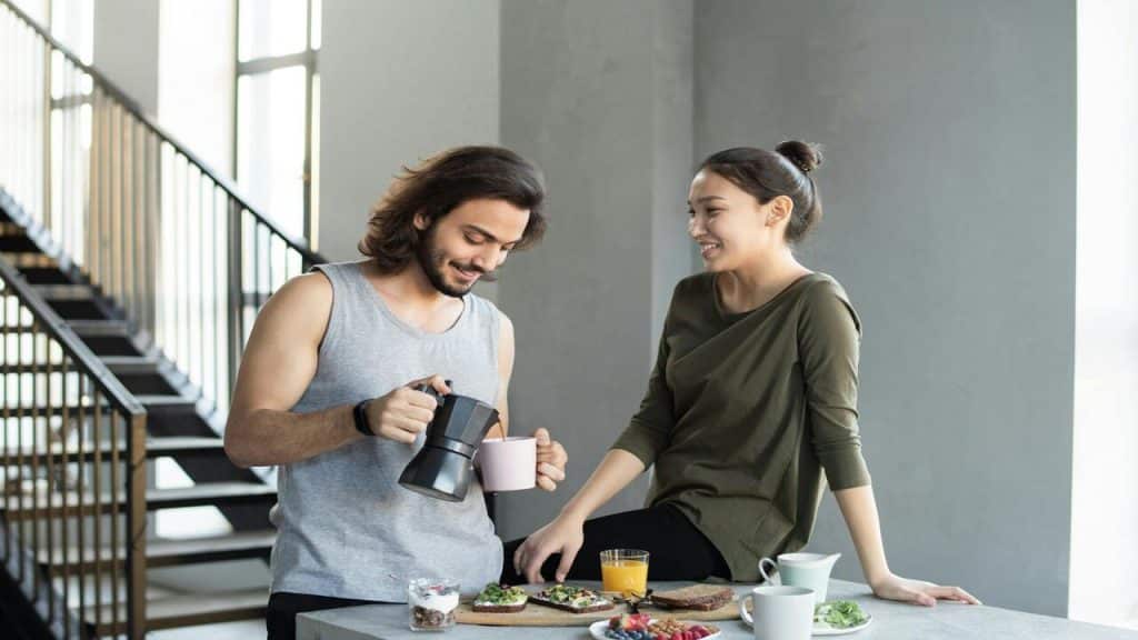 A couple talking while having breakfast
