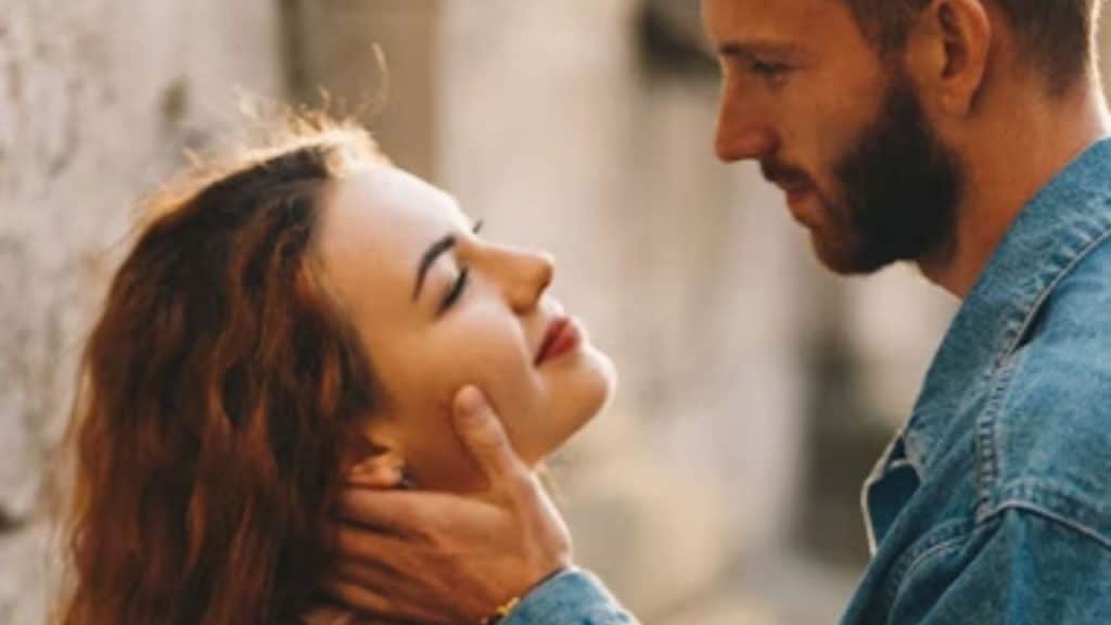 A man and woman hugging his partner with happy tears after a proposal