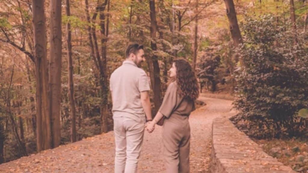 A couple talking while holding hands after a proposal