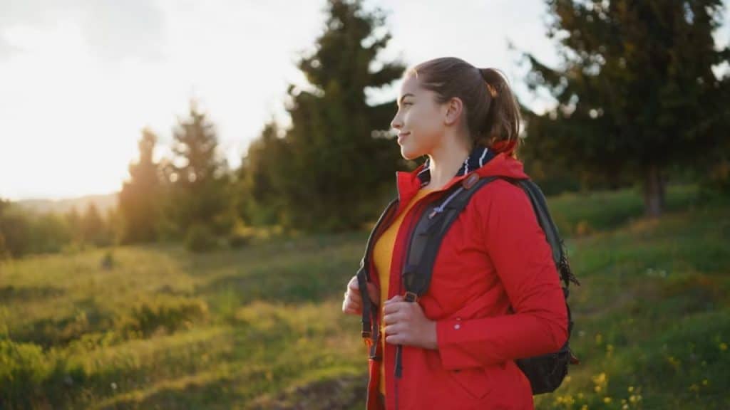 A woman enjoying a solo walk in the park