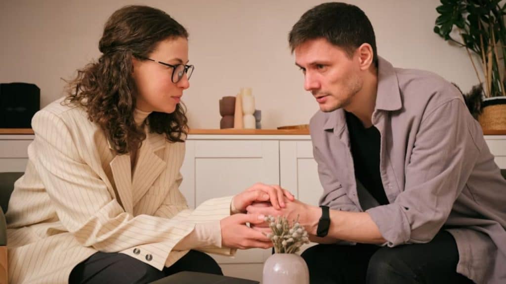 A woman comforting her partner during a difficult moment