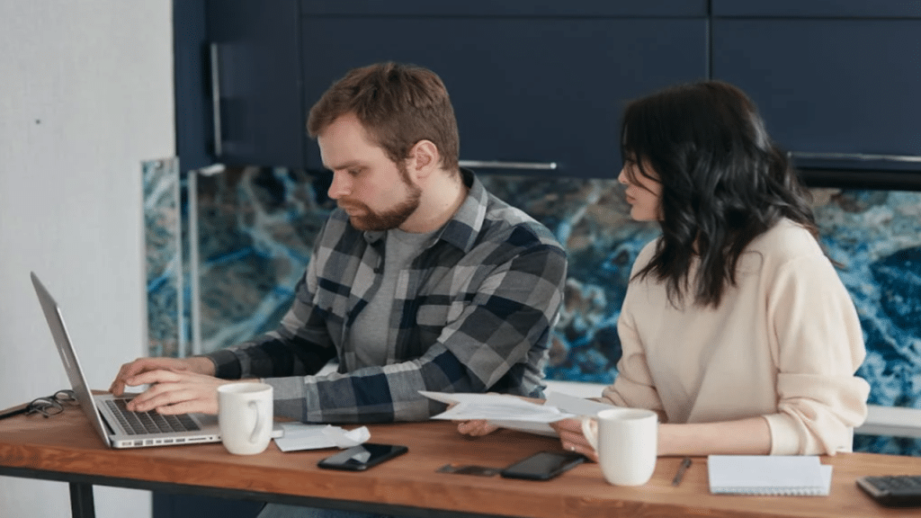 A couple working on their bills