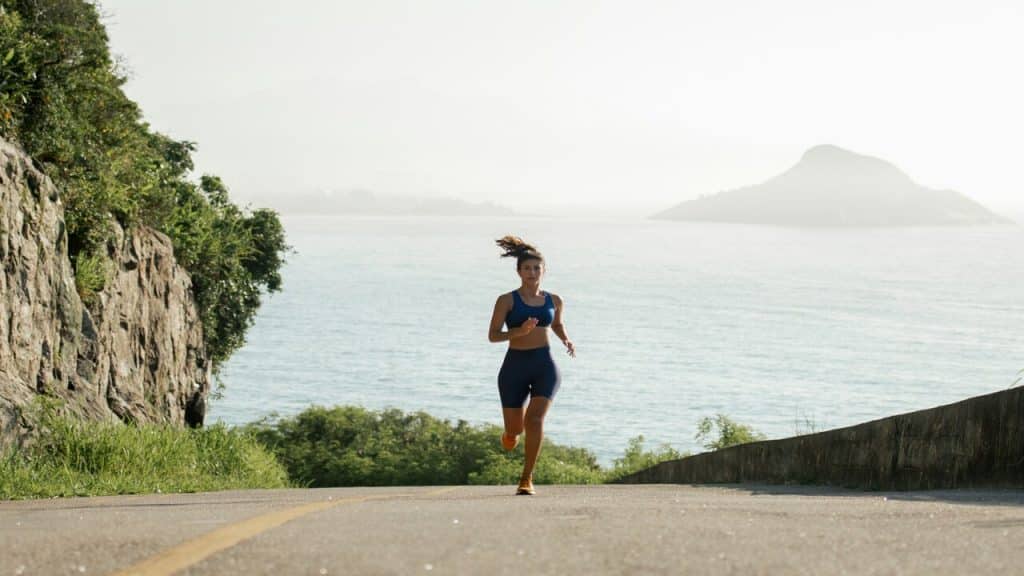 A woman jogging by herself.