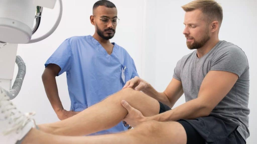 A man speaking with his doctor during a checkup