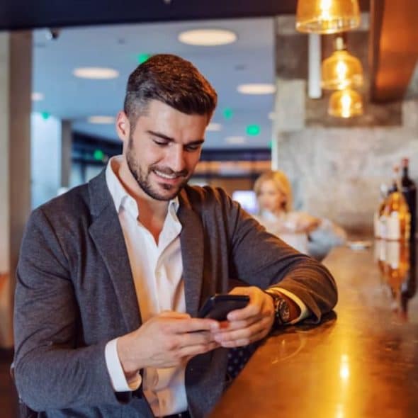 A man arriving at the cafe on time