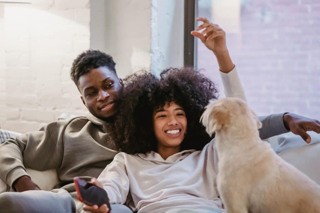 A man and woman with their dog