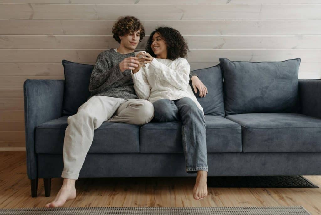 A man and woman at the couch