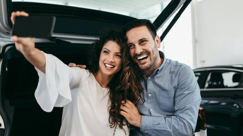 A smiling couple taking a selfie together.