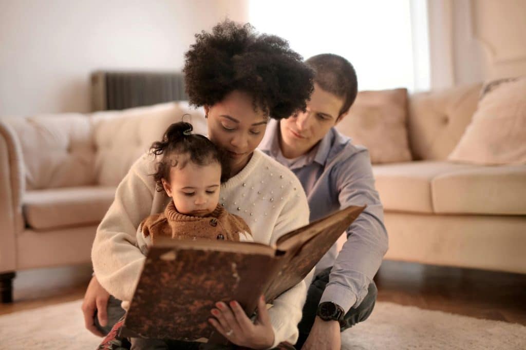 A man and woman bonding with their child