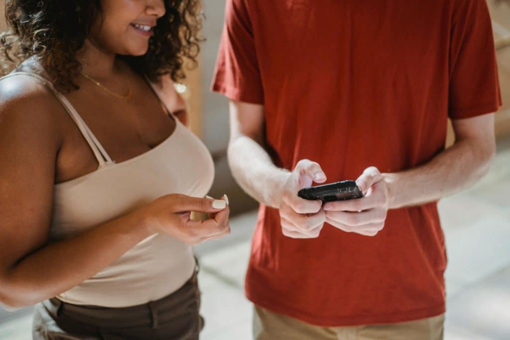 A man sharing a playlist to a woman
