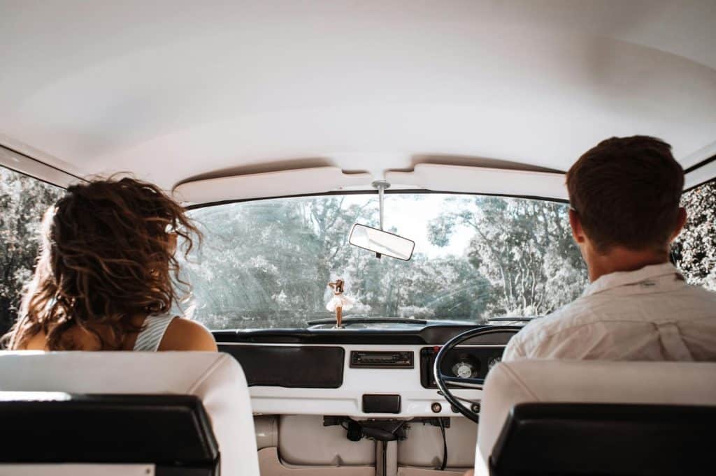 A man and woman inside the car