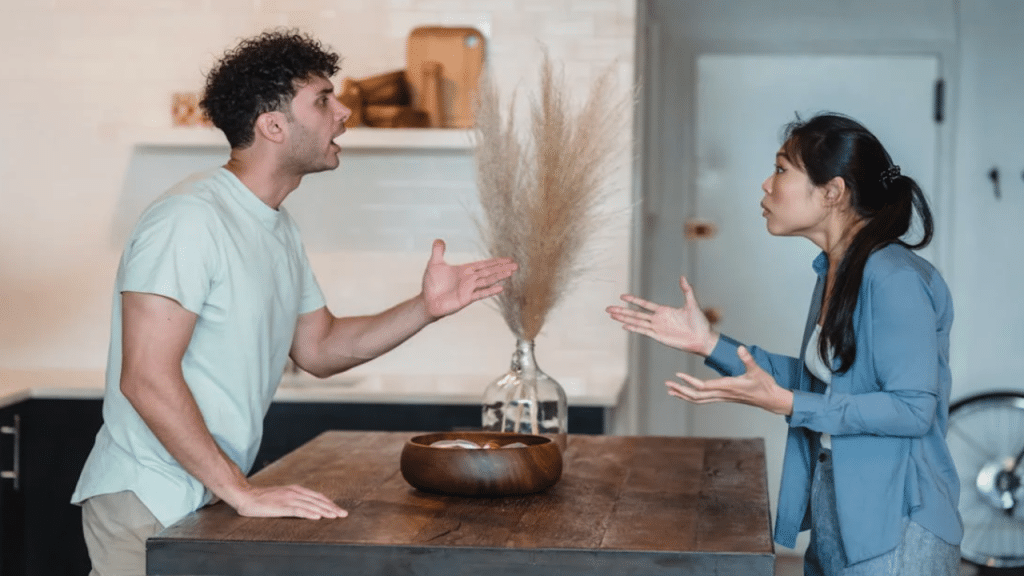 A couple fighting in the kitchen