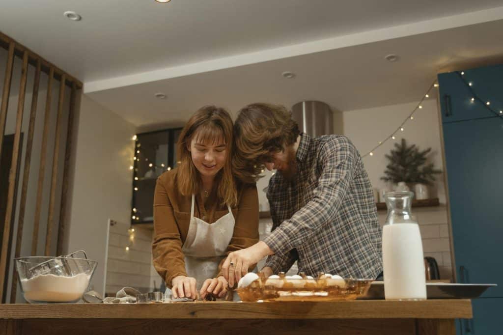 A man and woman cooking together
