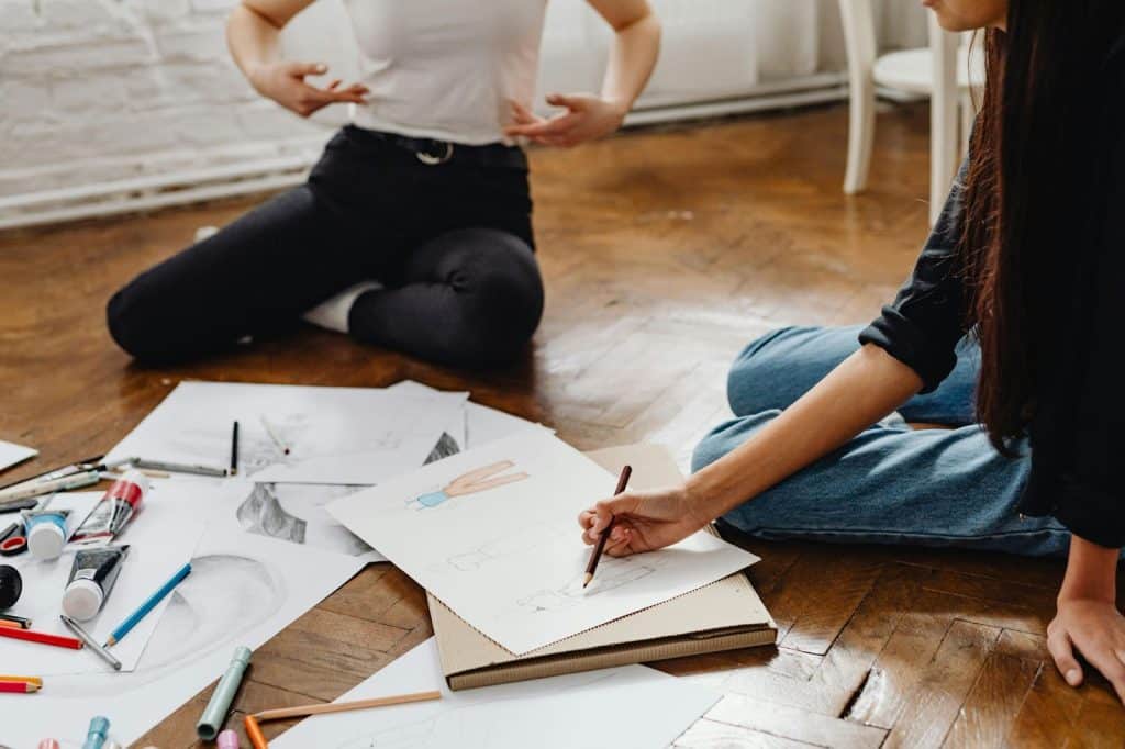 A man and woman having a sketch session