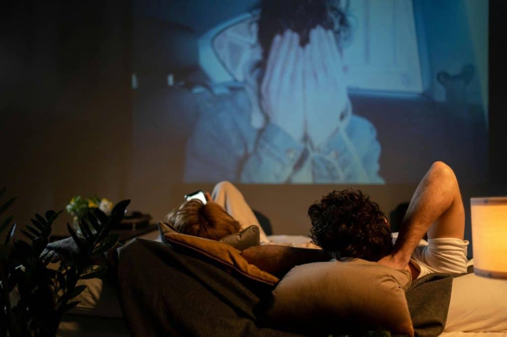 A man and woman watching movie