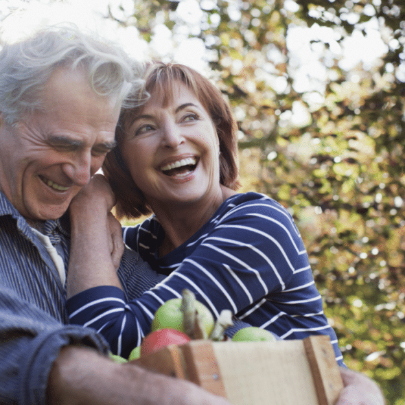 A mature couple just getting back from grocery shopping