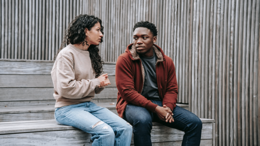 A couple talking outdoors