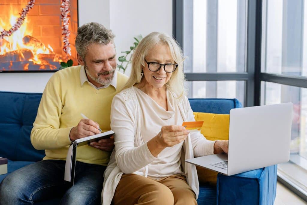 A man and woman checking their expenses