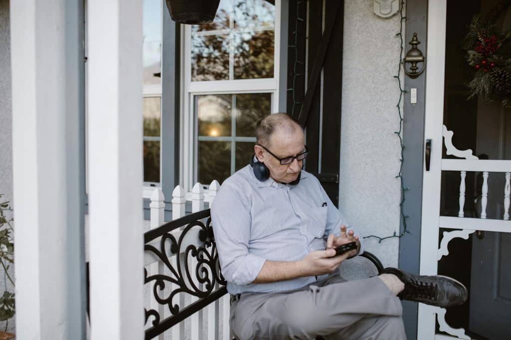 A man outside the porch