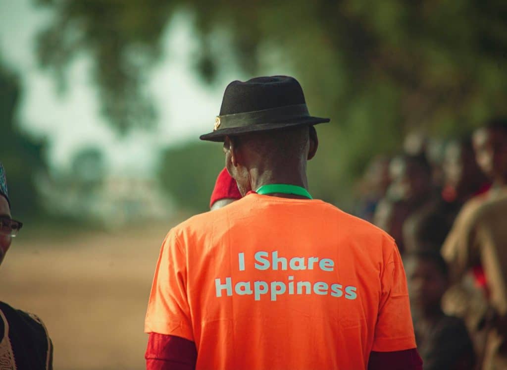 A man wearing a shirt with words