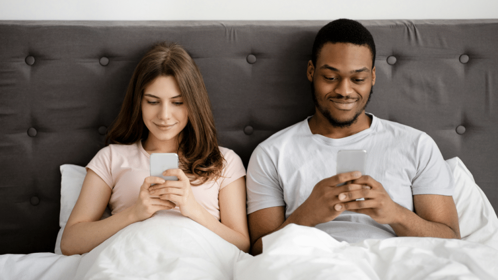 A couple busy using their phones