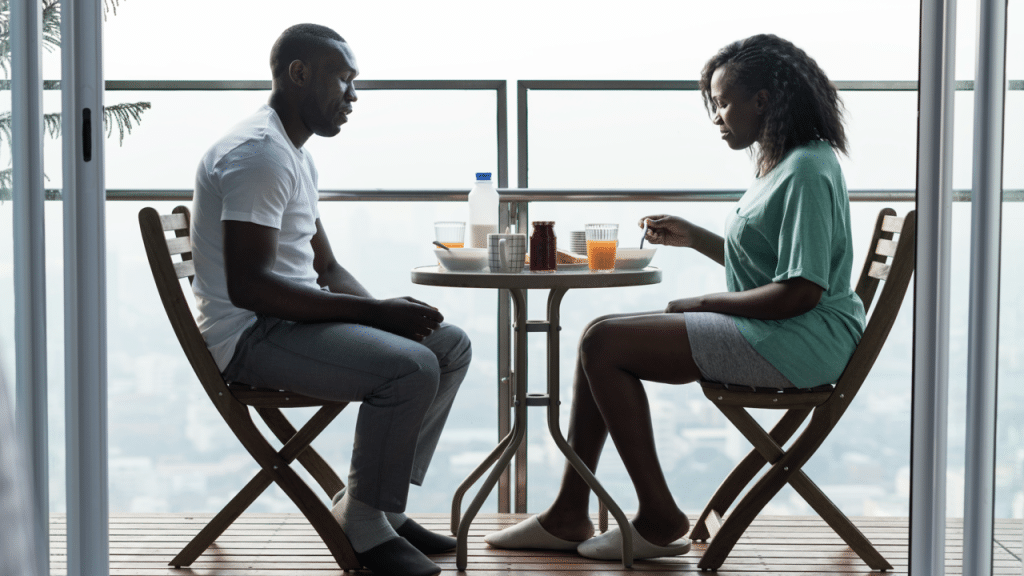 A couple talking on the balcony