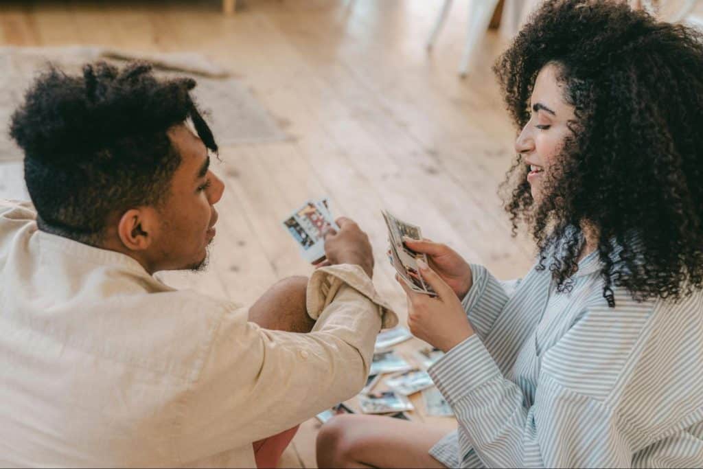 A man and woman looking at their photos 