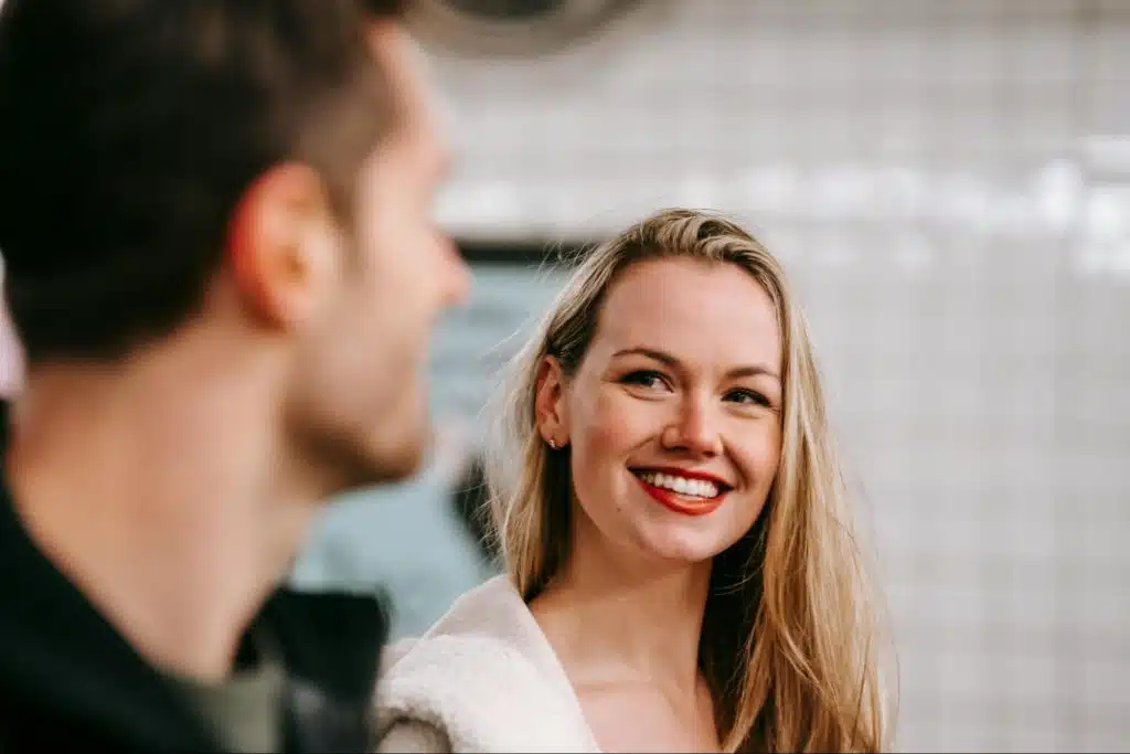 A man focusing his gaze on her