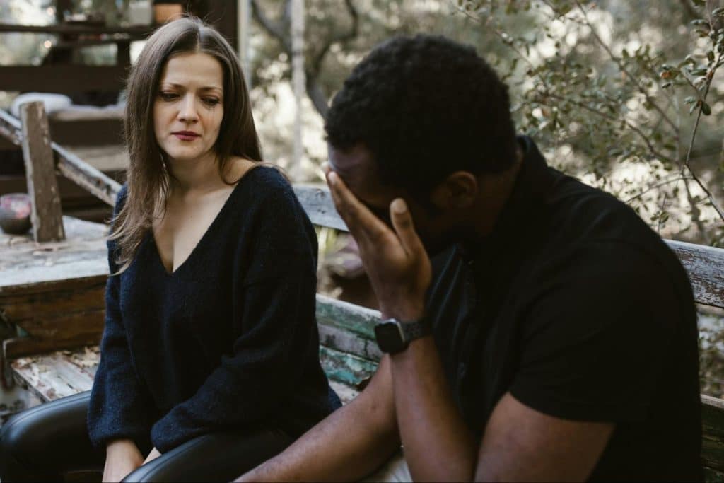 A woman looking at the man