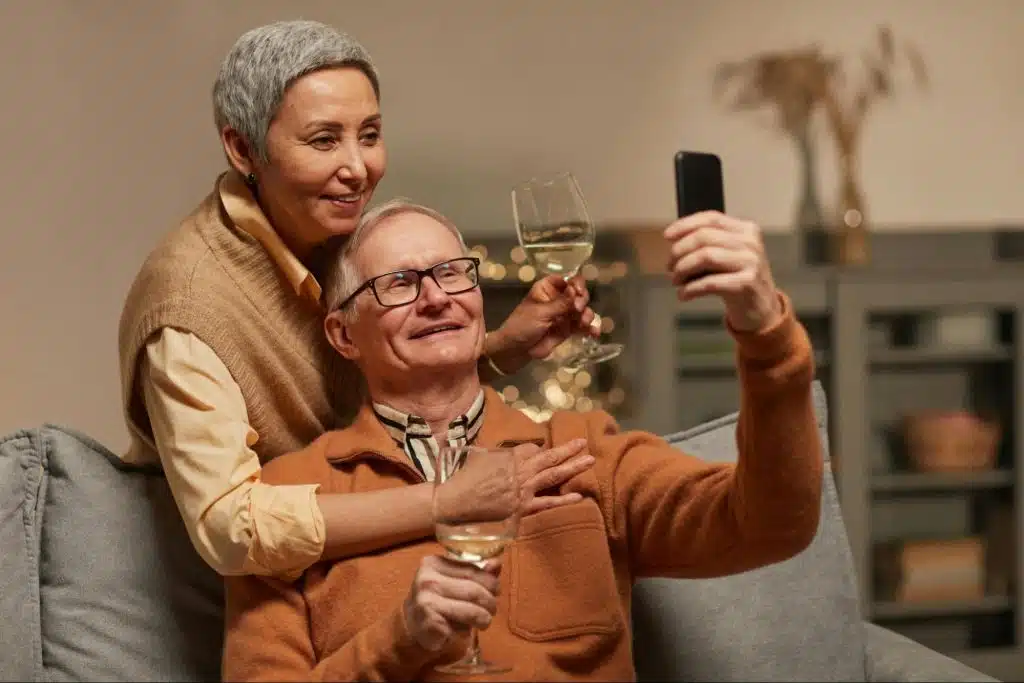 A man showing something on phone to woman