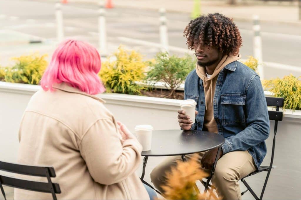 A man and woman having a casual coffee