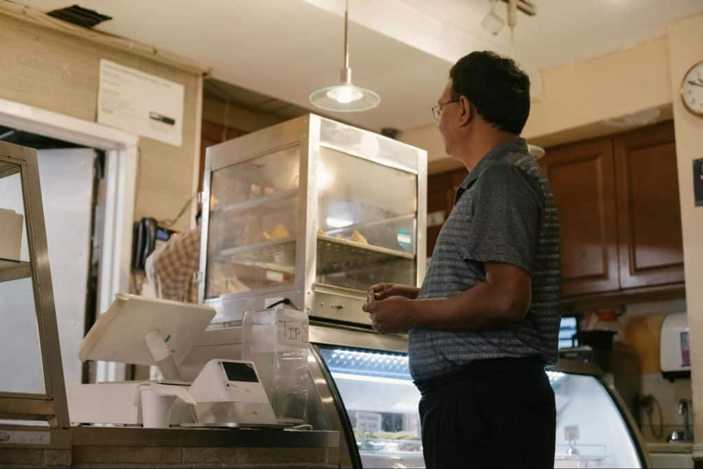 A man paying at the counter