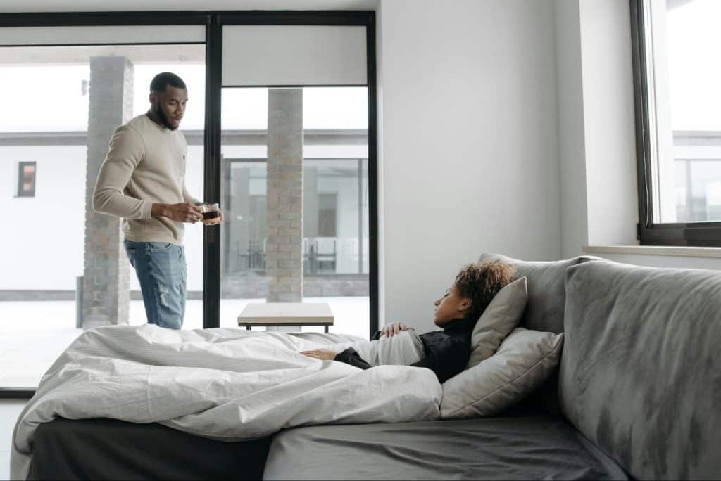 A man taking care of woman