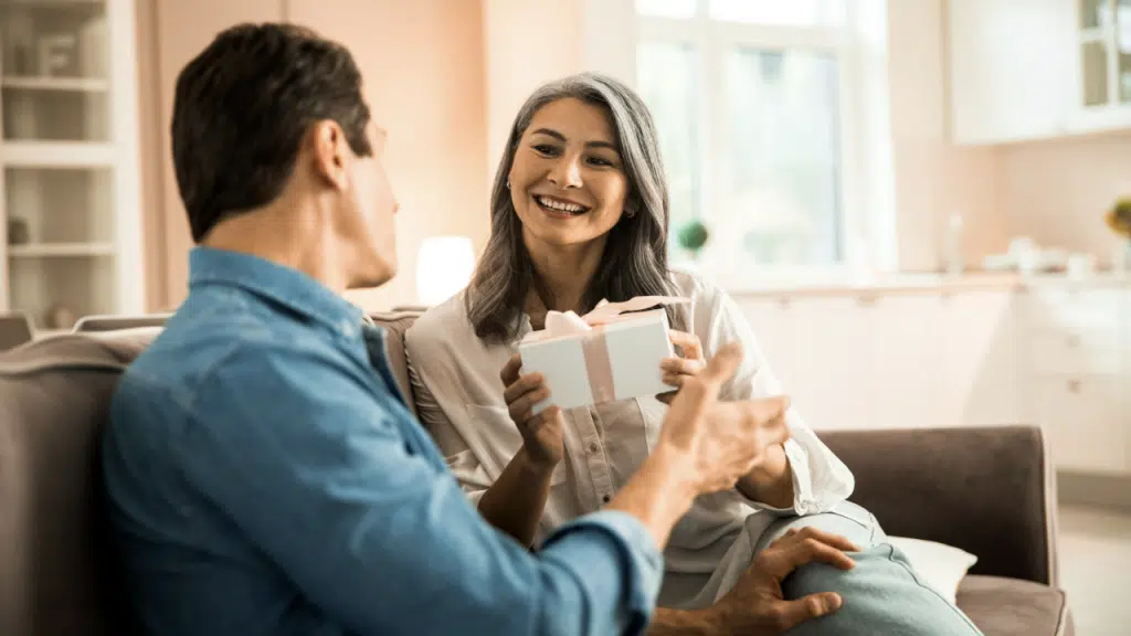 A wife receiving a gift from her husband