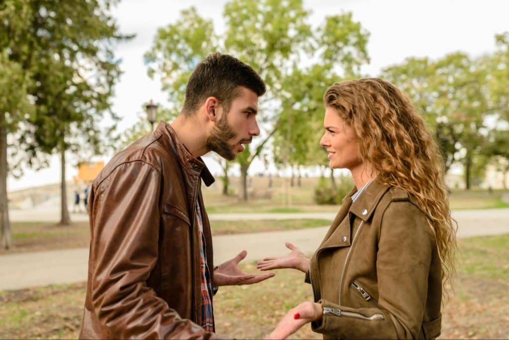 A man and woman facing each other